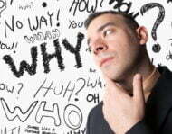 A business man that looks worried about questions floating around in his head.